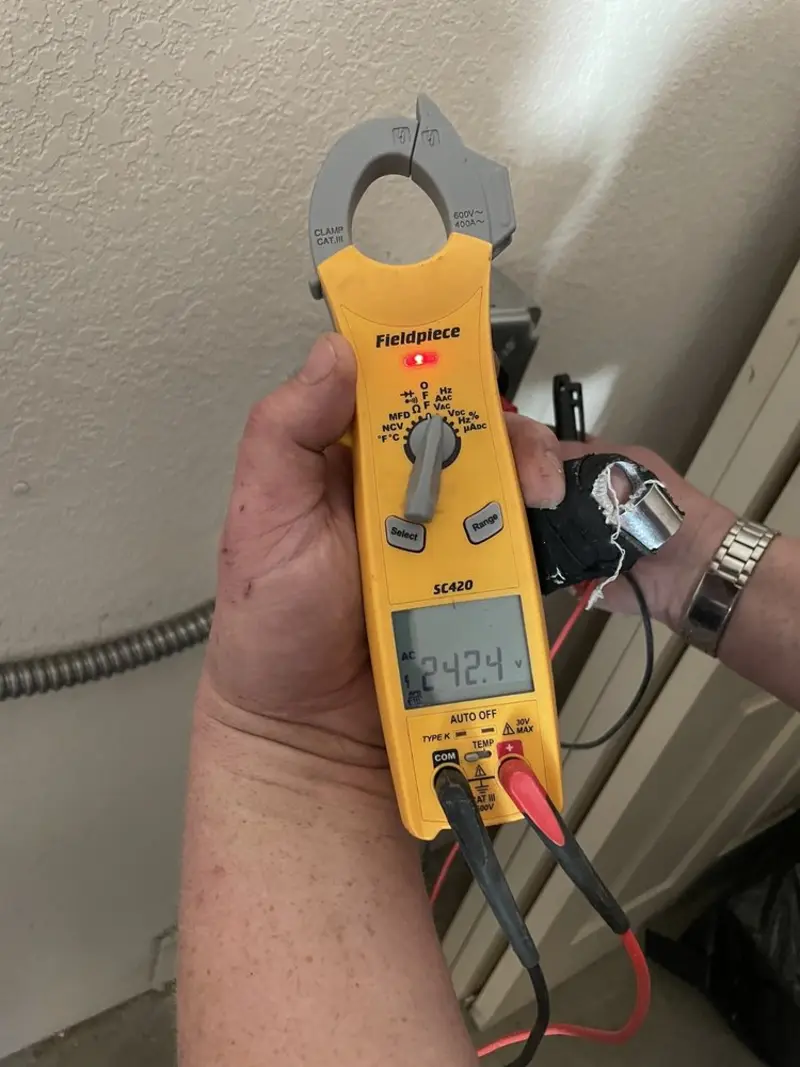 Voltage testing with clamp meter during Outlet Installation in Teague